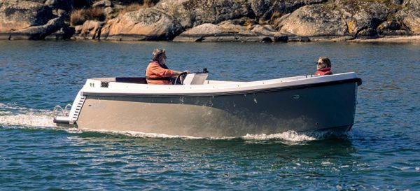 Electric boat Bella Zero with two people on board. Boating is easy with Bella ZERO electric boats.